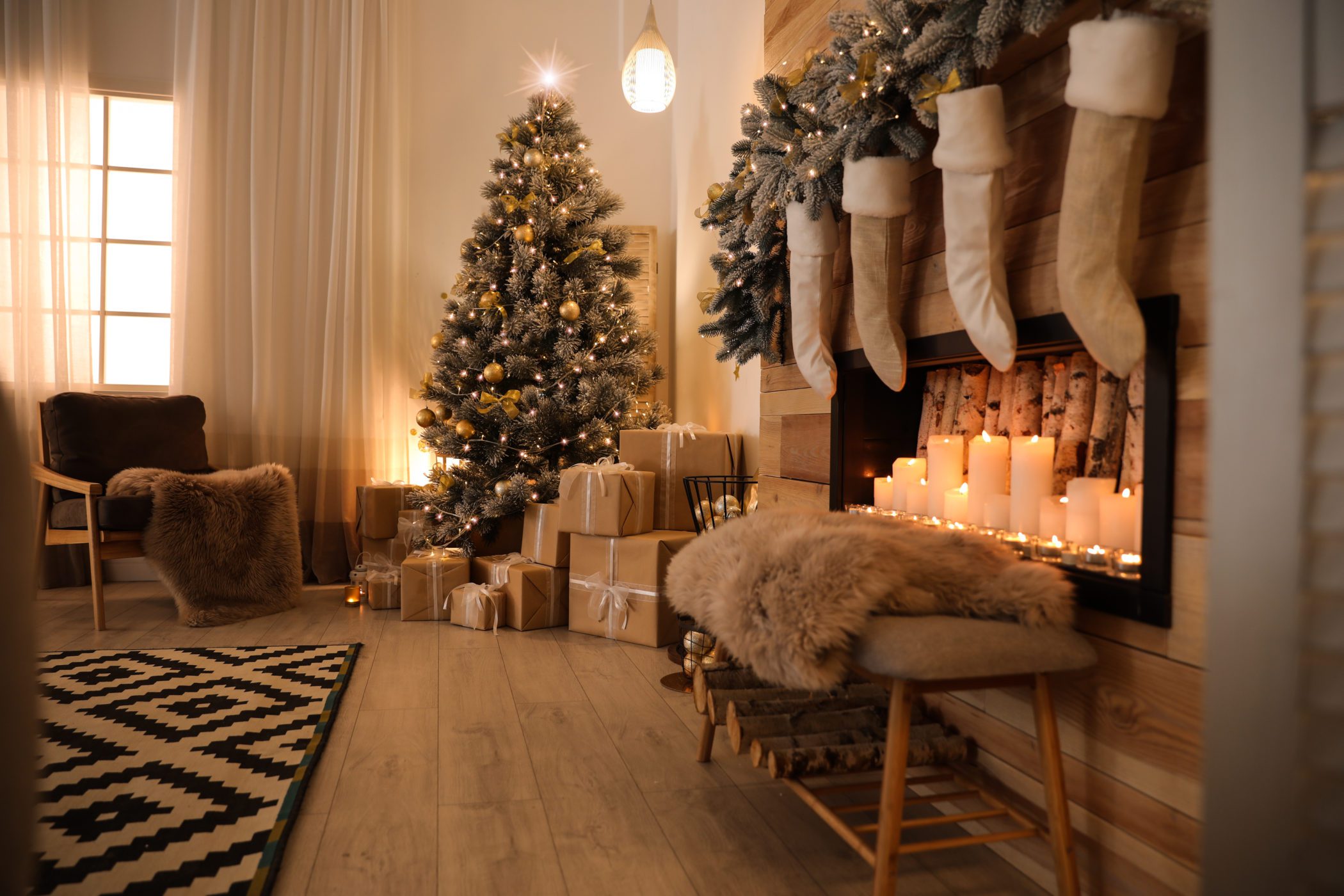 Stylish room interior with beautiful Christmas tree and decorati